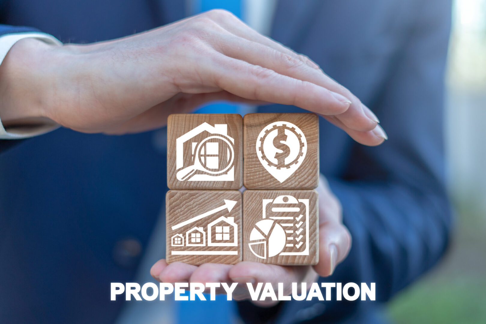 A person holding out their hands with the words property valuation written underneath them.
